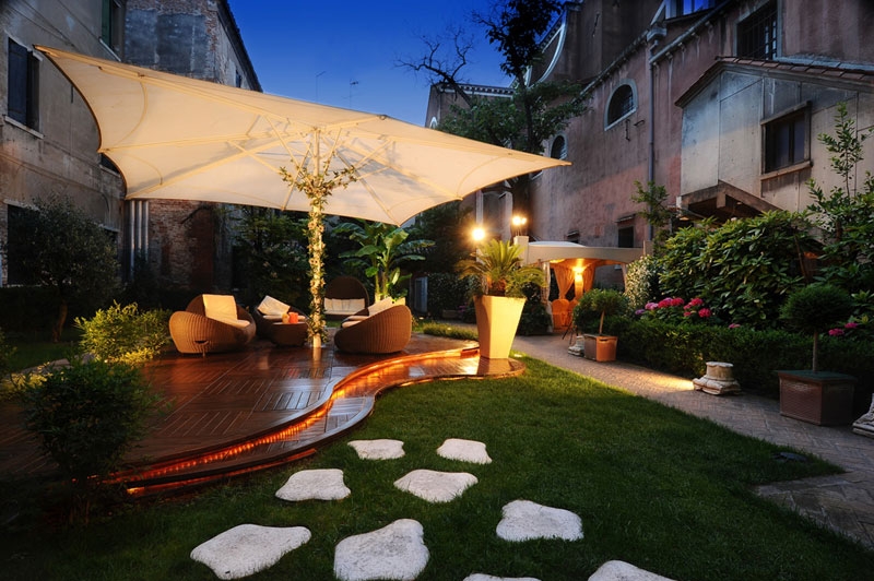 Hotel Abbazia — courtyard garden at dusk