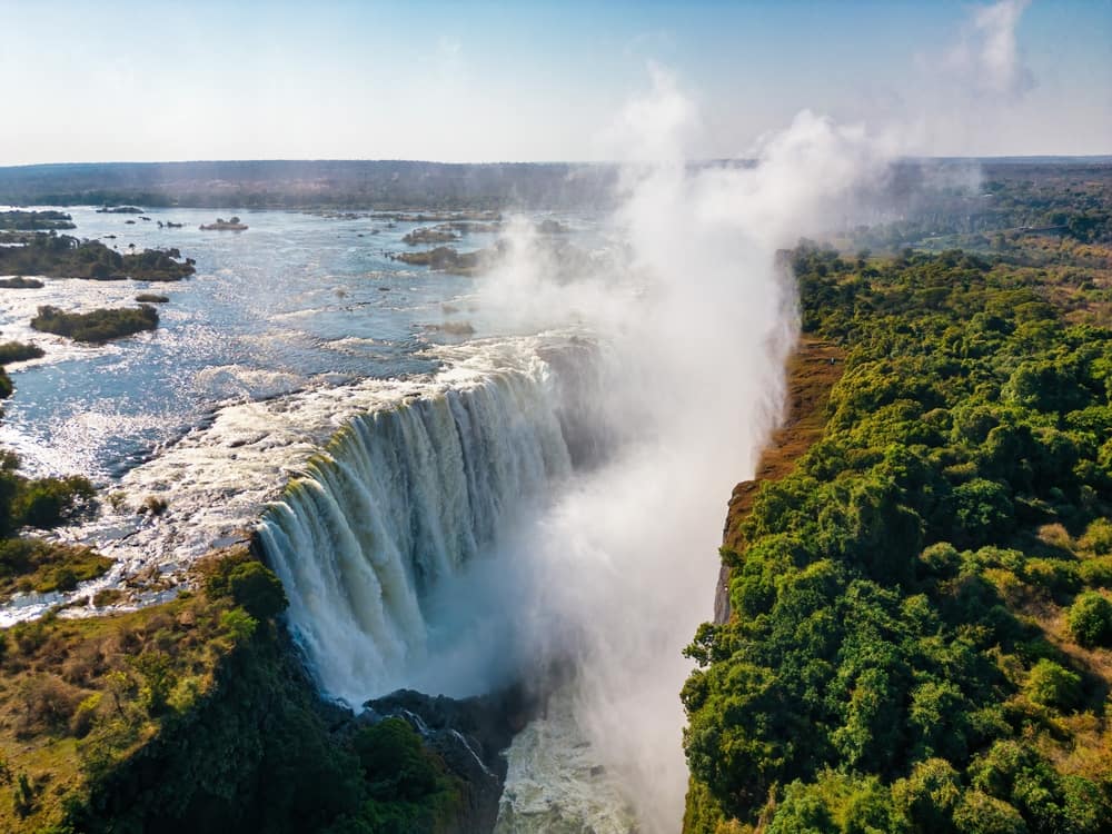 Victoria Falls aerial — the full scale of the falls and spray